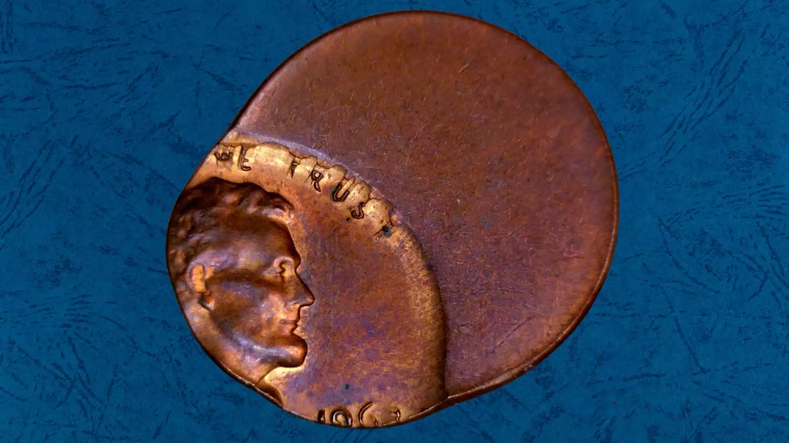 1963 Lincoln penny off-center strike error showing shifted design with blank planchet crescent on one edge