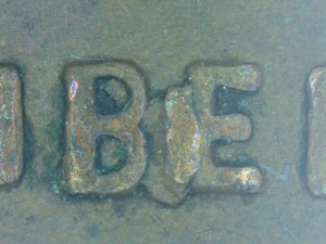 1963 Lincoln penny BIE die break error showing raised vertical crack between B and E in LIBERTY inscription